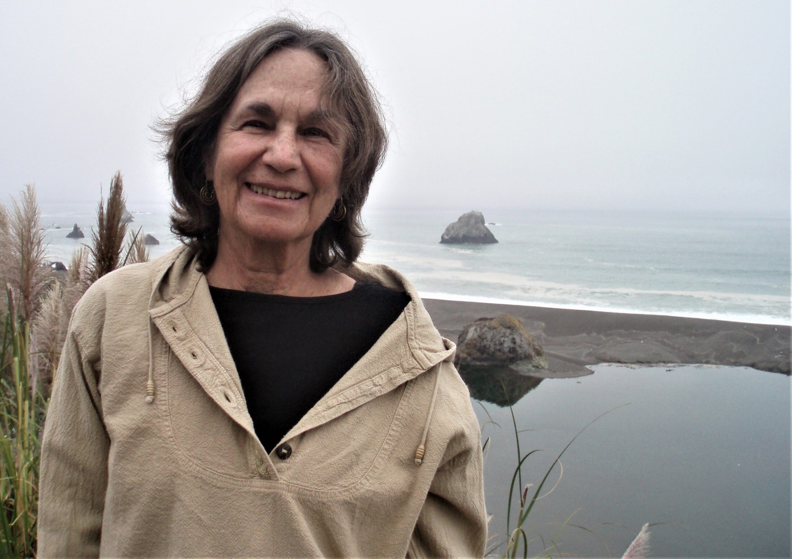 Author and poet Judith Cohen on the shore.